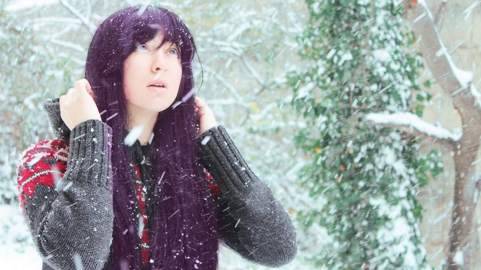 Woman with purple hair in the snow