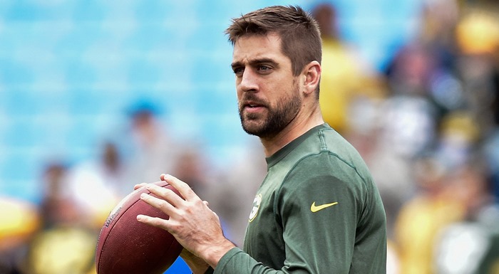 Aaron Rodgers holding a football