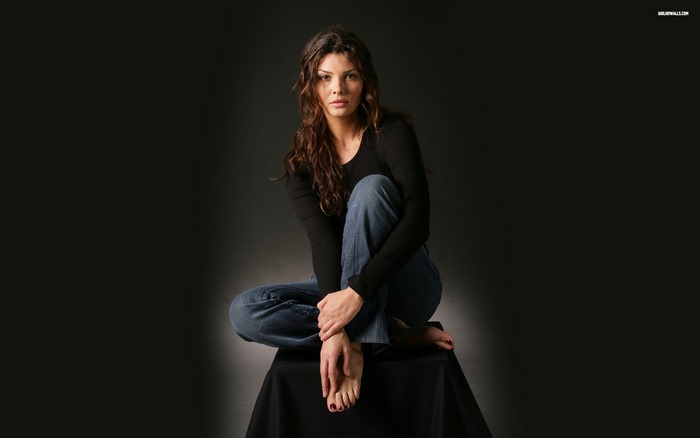 Ali Landry sitting on a stool
