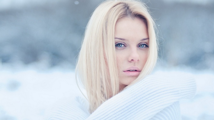 Woman with blonde hair in the snow