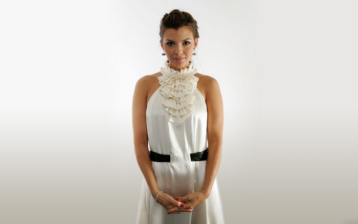 Ali Landry in a white ruffled dress