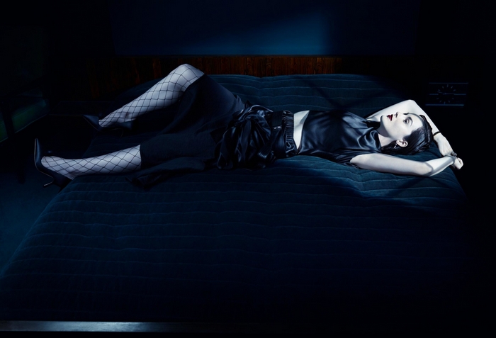 Michelle Dockery lying on a bed