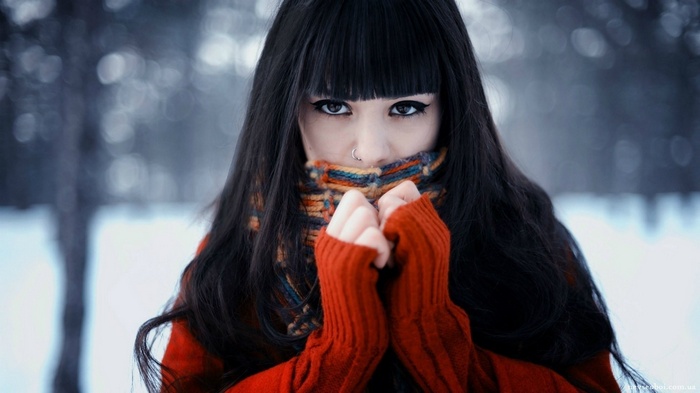 Woman in red sweater and scarf in winter