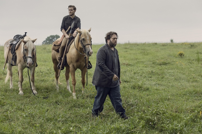 Dan Fogler on horseback in a field