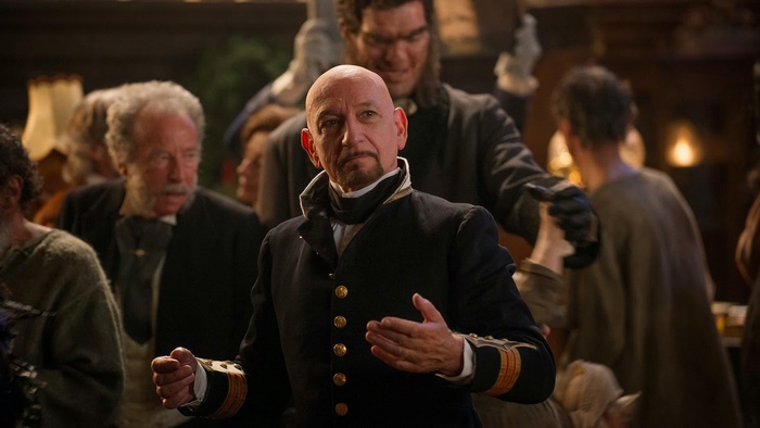 Ben Kingsley in a dark costume