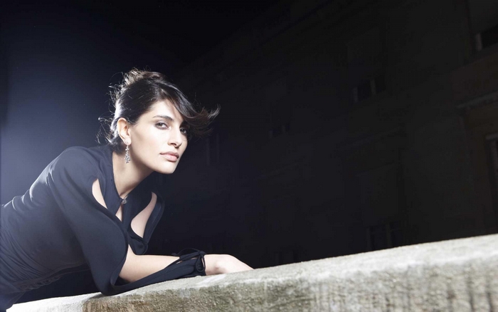 Caterina Murino posing at night