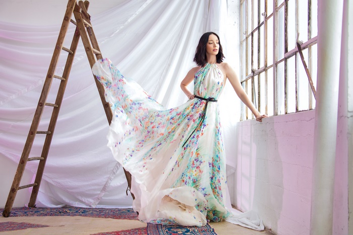 Emma Dumont in a floral dress