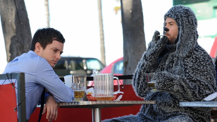 Elijah Wood and Jason Gann in a dog costume