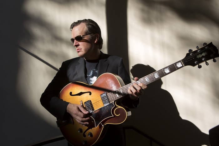 Joe Bonamassa playing a guitar