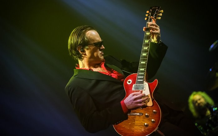 Joe Bonamassa playing guitar on stage