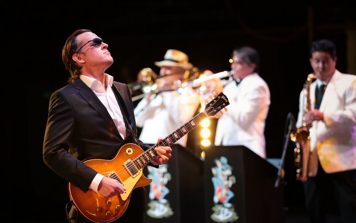Joe Bonamassa performing with a band