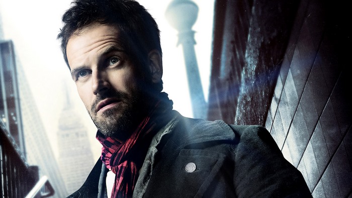 Jonny Lee Miller in a city setting