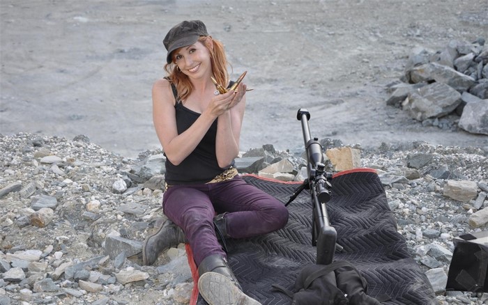 Kari Byron with bullets and sniper rifle