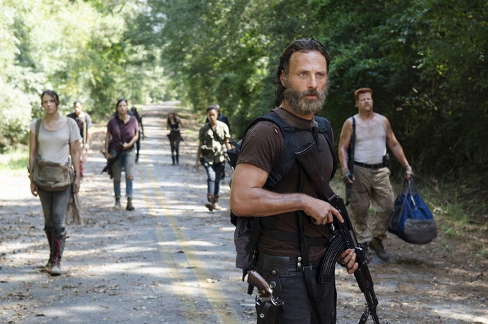 Rick Grimes and survivors walking on road