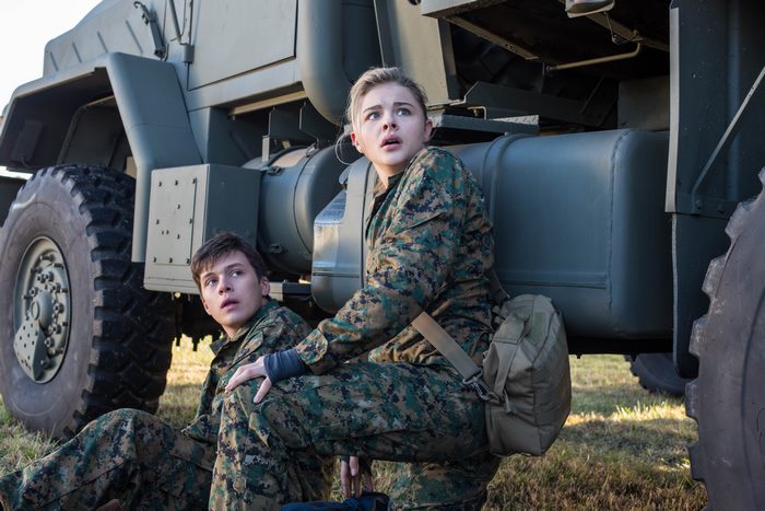Nick Robinson and Chloe Grace Moretz in military uniforms