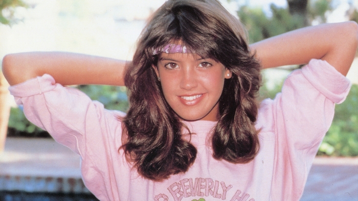 Phoebe Cates in a pink shirt