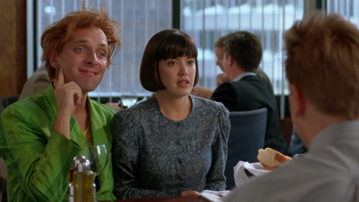 Phoebe Cates in a restaurant