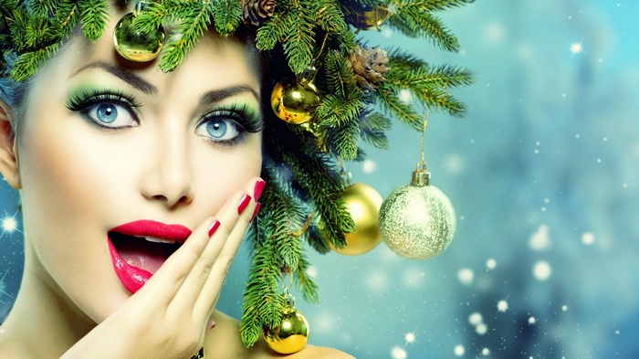Woman with Christmas tree ornaments in hair