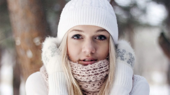 Woman in winter clothing in a forest