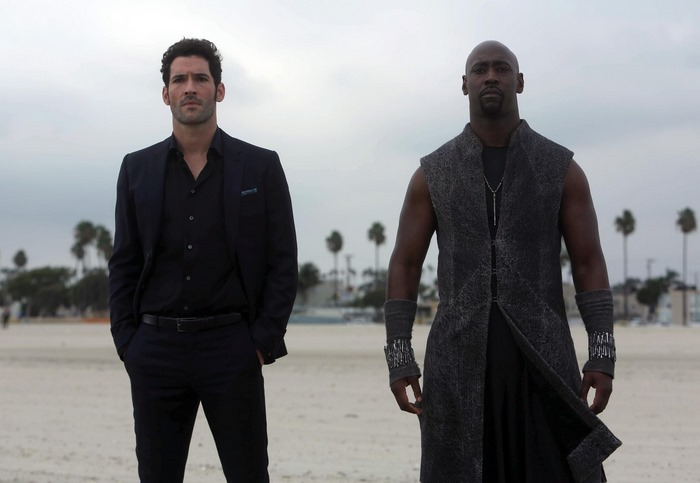 Tom Ellis and D.B. Woodside on a beach