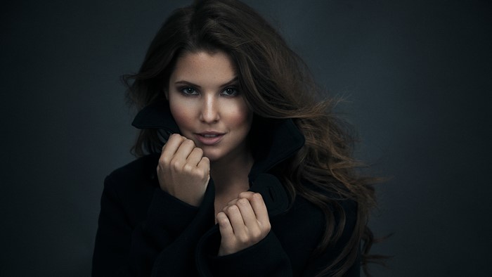 Amanda Cerny in a black coat