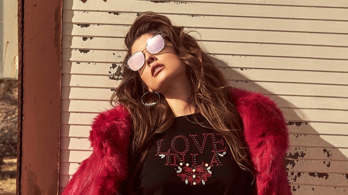 Amanda Cerny in a red fur coat