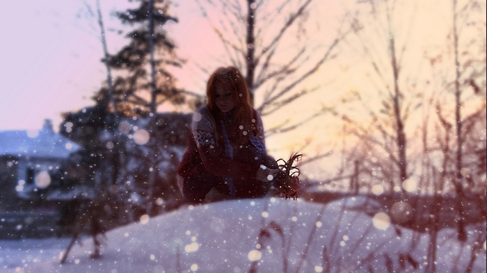 Girl in snow holding flowers