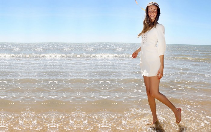 Isabel Lucas on a beach