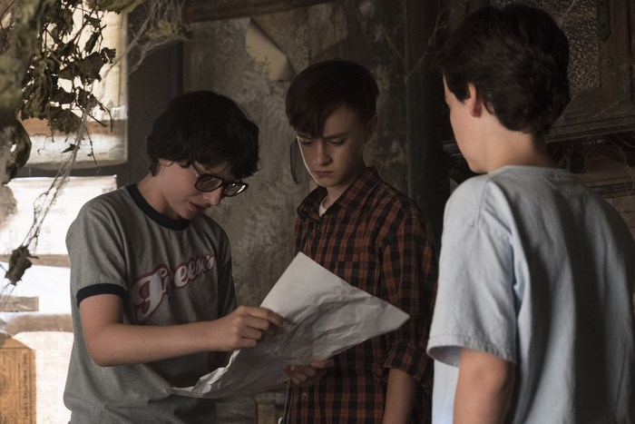 Jack Dylan Grazer and friends looking at a map