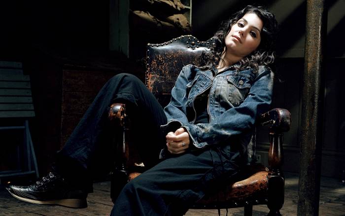 Katie Melua sitting in a leather chair
