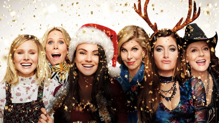 A Bad Moms Christmas cast with confetti