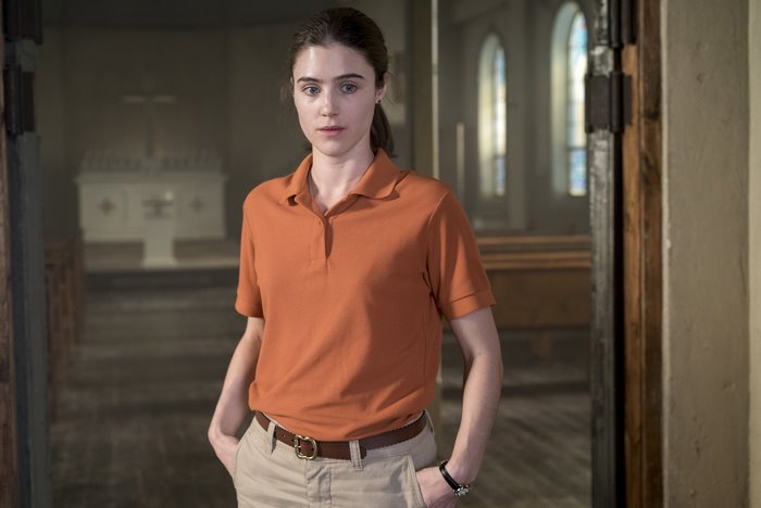 Lucy Griffiths in an orange polo shirt
