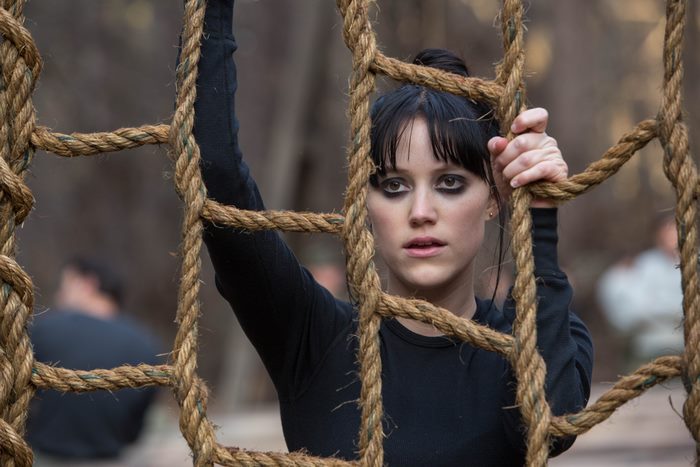 Maika Monroe on a rope obstacle course