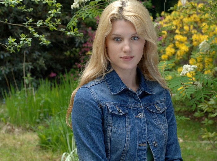 Lucy Griffiths in a denim jacket outdoors