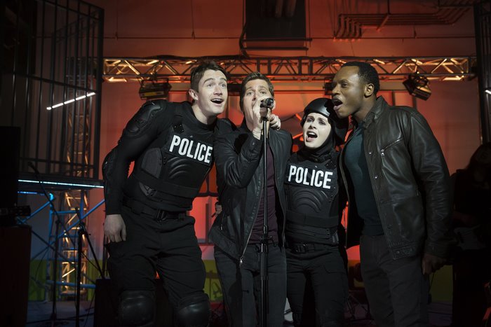 Malcolm Goodwin and police officers singing