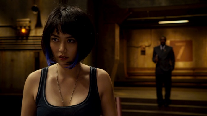 Rinko Kikuchi in a dark hallway