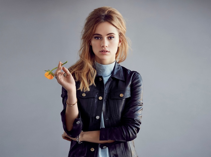 Suki Waterhouse with orange flower