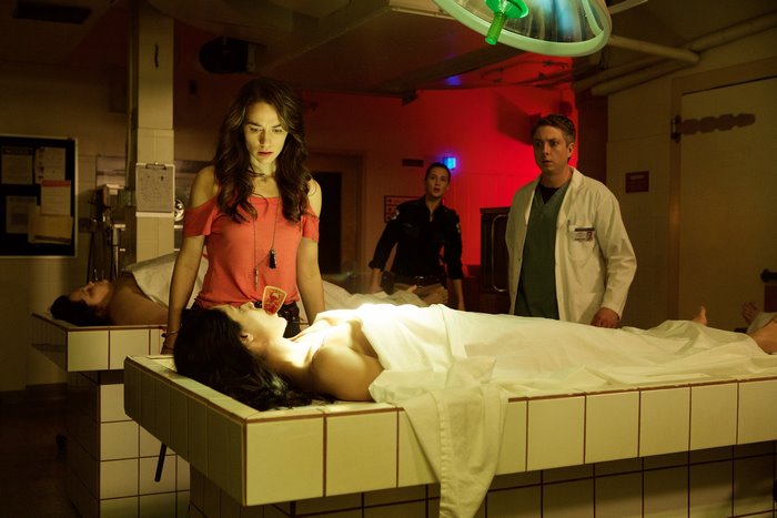 Tim Rozon and two women in a morgue