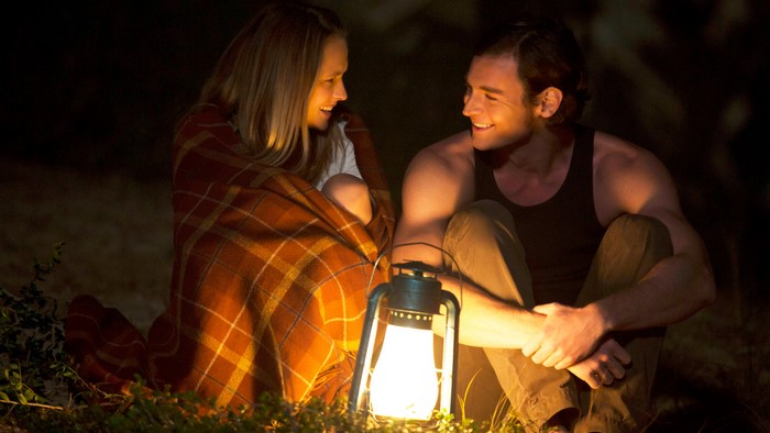Benjamin Walker and a woman by a lantern