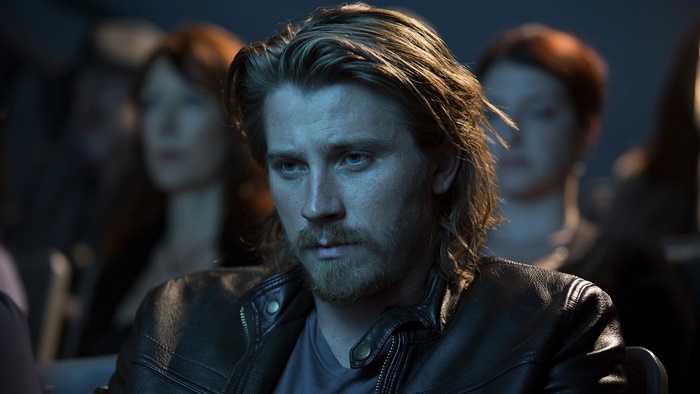 Garrett Hedlund in a dark room