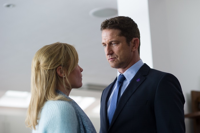 Gerard Butler and Radha Mitchell in an indoor setting