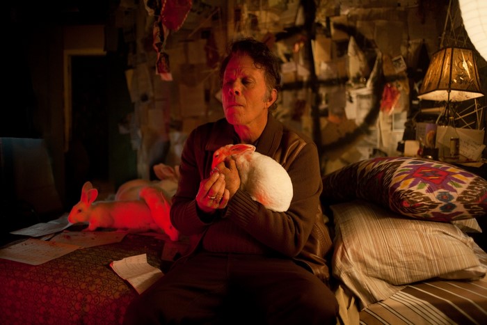 Tom Waits holding a rabbit