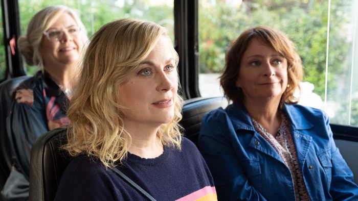Amy Poehler and two women on a bus