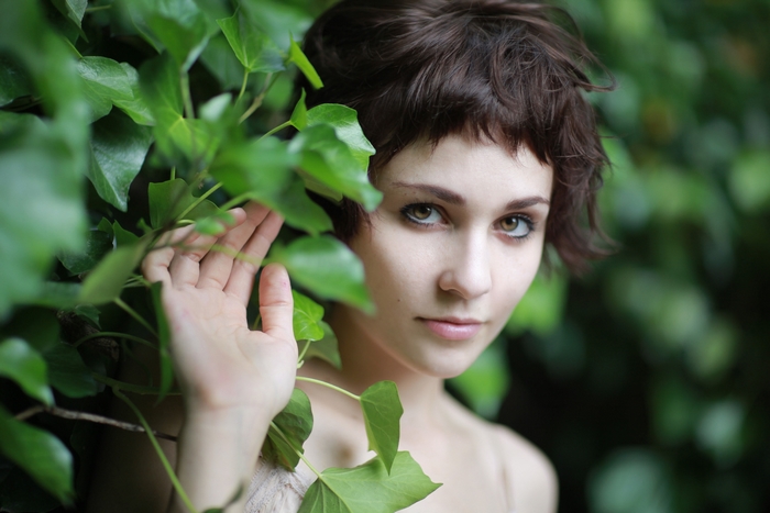 Tuppence Middleton among green leaves