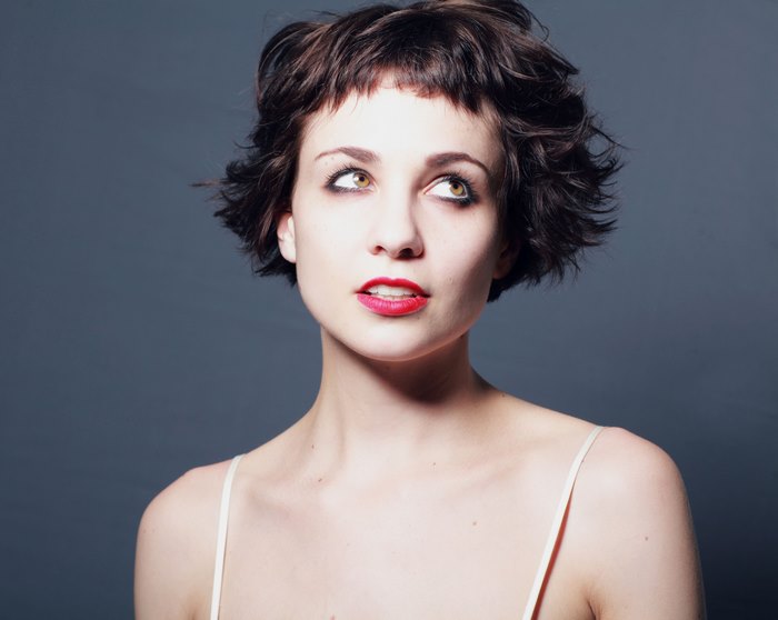 Young Woman with Short Wavy Hair and Red Lipstick
