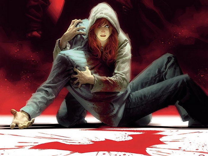 Barbara Gordon holding a wounded person