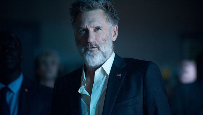 Bill Pullman in a dark suit