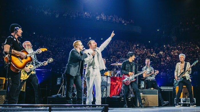 U2 performing live on stage