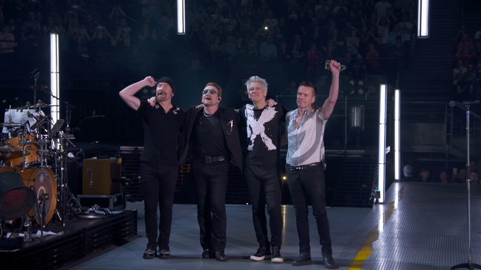 U2 band members on stage