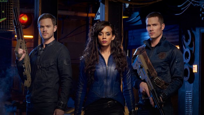 Hannah John-Kamen and two men with guns